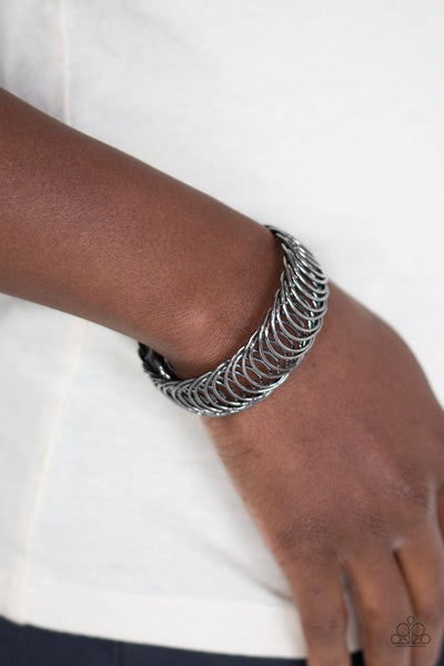 Dizzyingly Demure - Black gunmetal bracelet